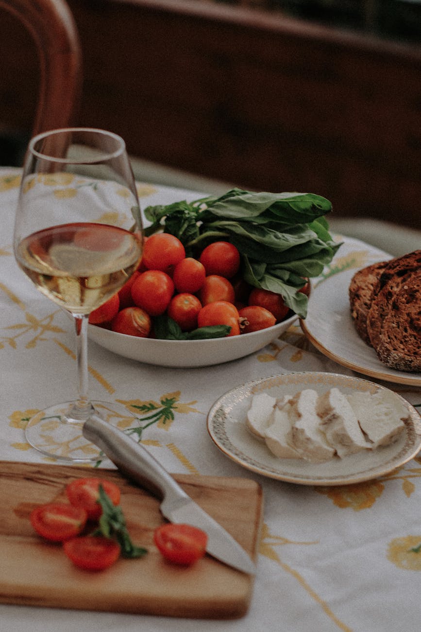 food and a glass of white wine on a table